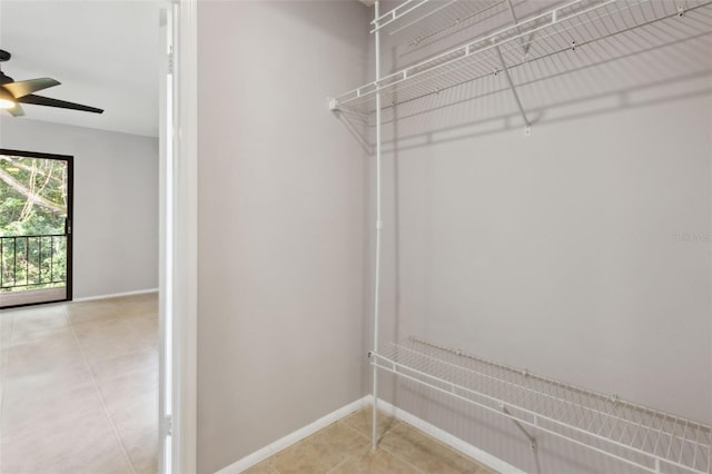 walk in closet featuring ceiling fan and light tile patterned floors