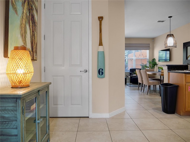 hallway with light tile patterned floors