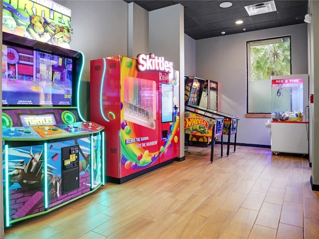 game room featuring a paneled ceiling