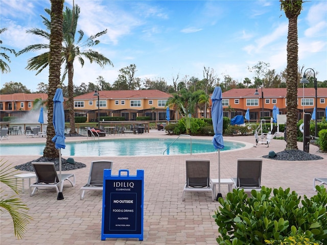 view of swimming pool with a patio