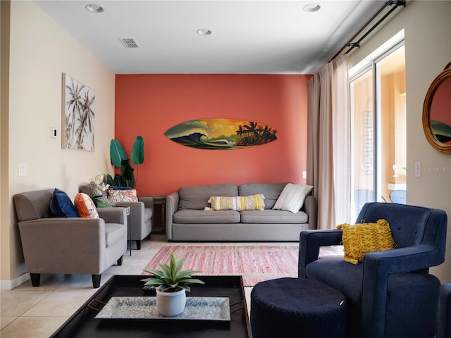 living room featuring visible vents and light tile patterned floors