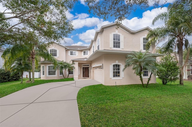 view of front facade with a garage and a front yard