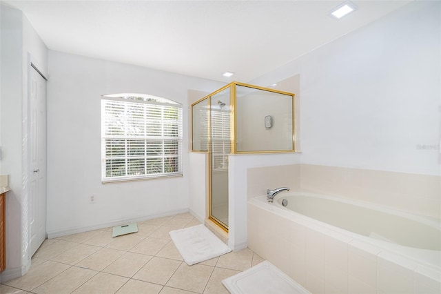 bathroom featuring vanity, tile patterned floors, and plus walk in shower