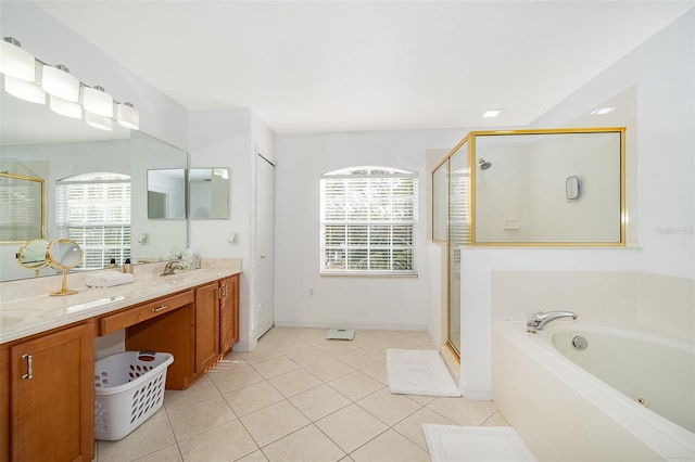 bathroom with shower with separate bathtub, plenty of natural light, and vanity