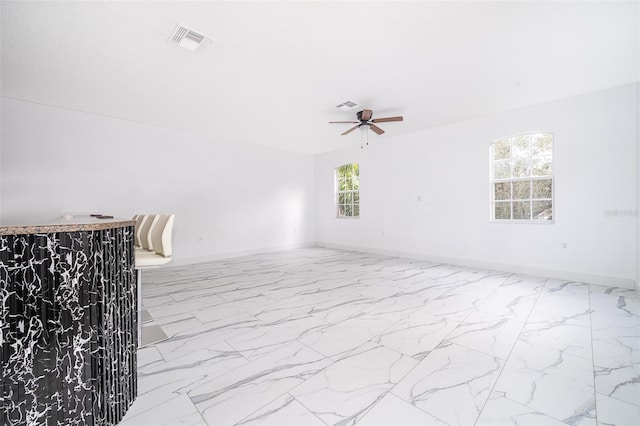 spare room featuring ceiling fan