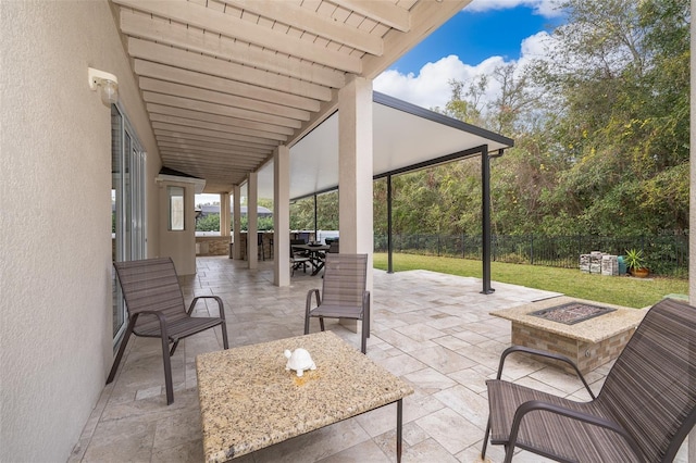 view of patio with a fire pit