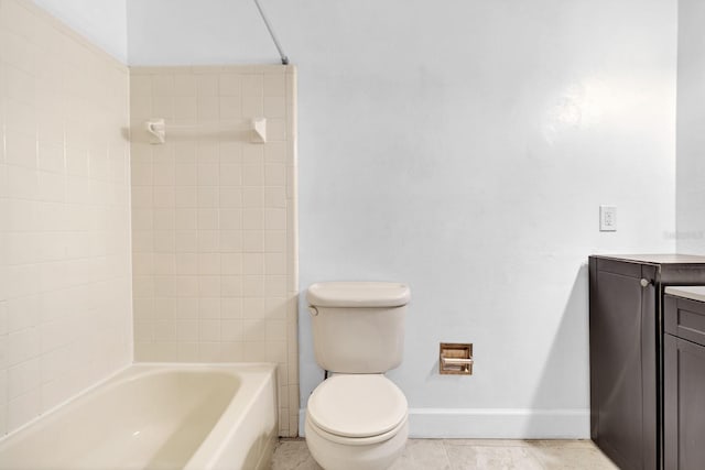 full bathroom with tiled shower / bath combo, vanity, and toilet