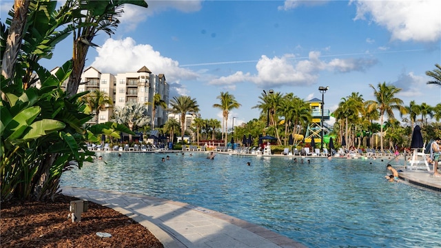 view of pool featuring a water view