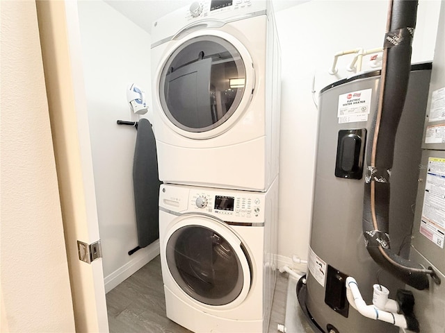 washroom with stacked washer and dryer, dark hardwood / wood-style floors, and water heater