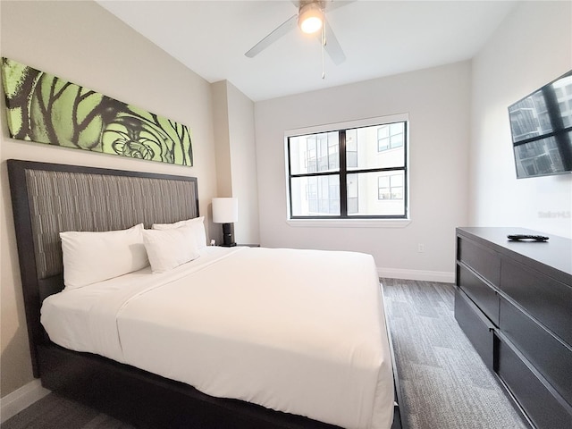 bedroom featuring dark wood-type flooring and ceiling fan