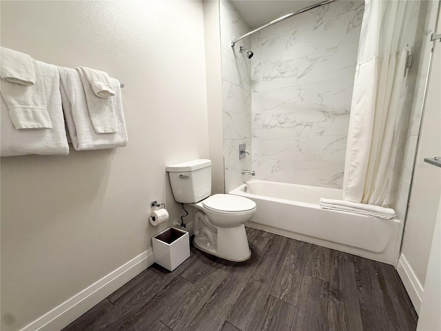 bathroom with hardwood / wood-style floors, shower / bath combination with curtain, and toilet