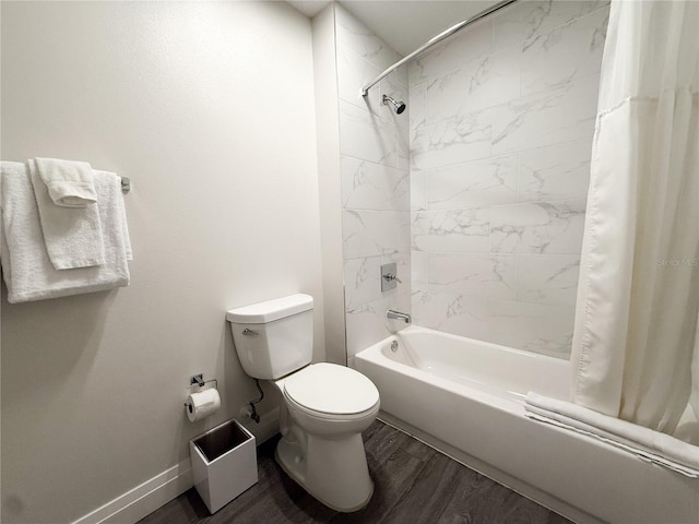 bathroom with shower / tub combo with curtain, wood-type flooring, and toilet