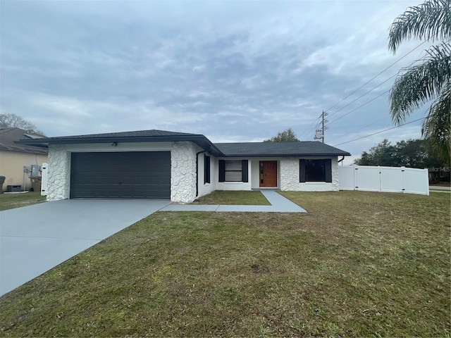 single story home with a front lawn and a garage