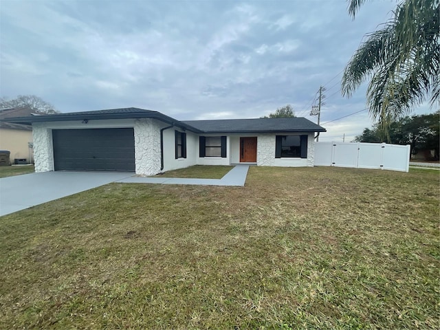 ranch-style house with a front lawn and a garage