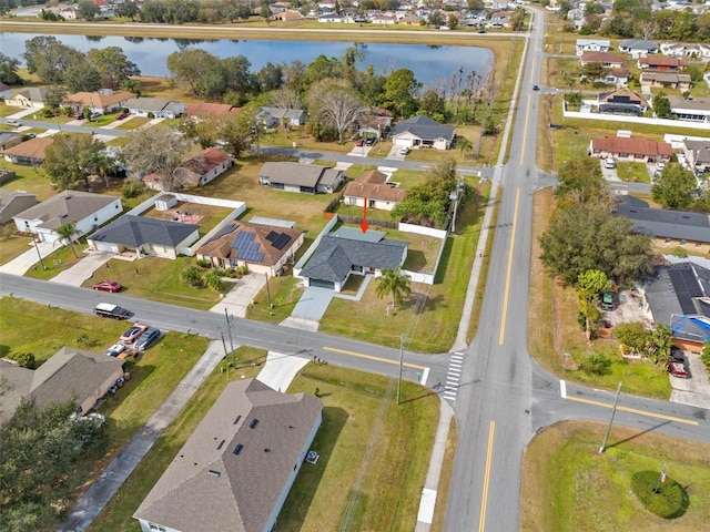 birds eye view of property featuring a water view