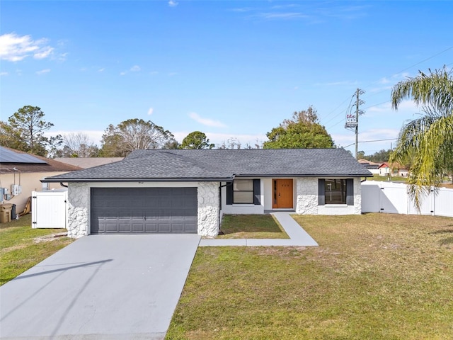 single story home with a garage and a front lawn