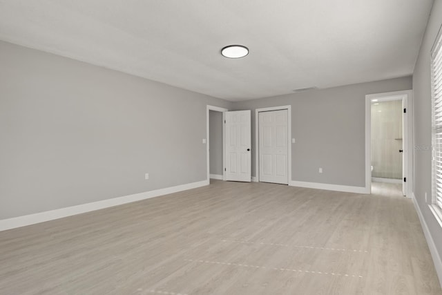 unfurnished room featuring light hardwood / wood-style flooring