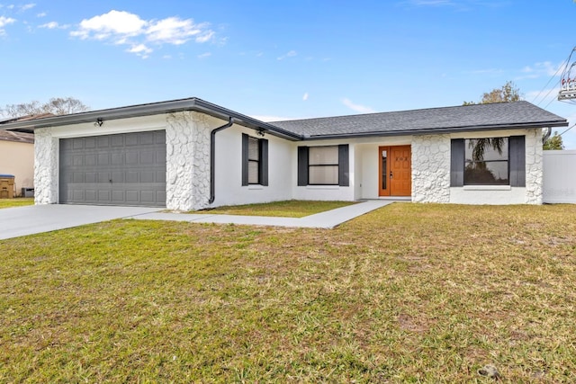 single story home with a garage and a front yard