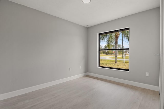 spare room with light wood-type flooring