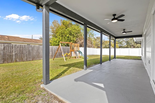 view of patio / terrace featuring ceiling fan and a playground