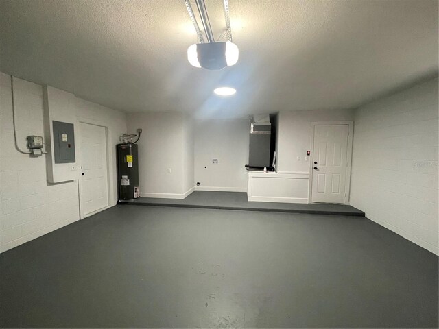 202 Cobalt Dr, Kissimmee, FL 34758 - garage with electric panel, water heater, heating unit, a garage door opener, and concrete block wall