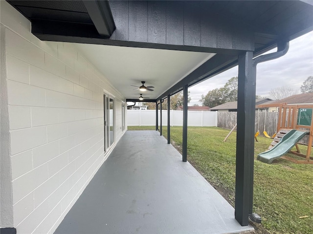 202 Cobalt Dr, Kissimmee, FL 34758 - fenced backyard featuring a patio area, a playground, and ceiling fan