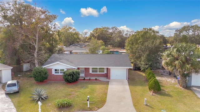 ranch-style home with a front lawn and a garage