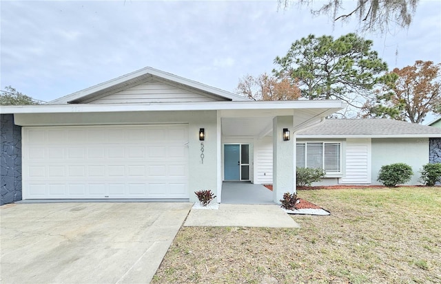 ranch-style home with a front yard and a garage