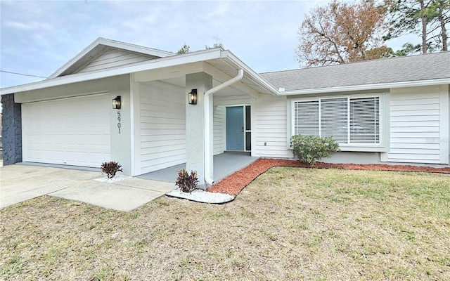 single story home with a front lawn and a garage