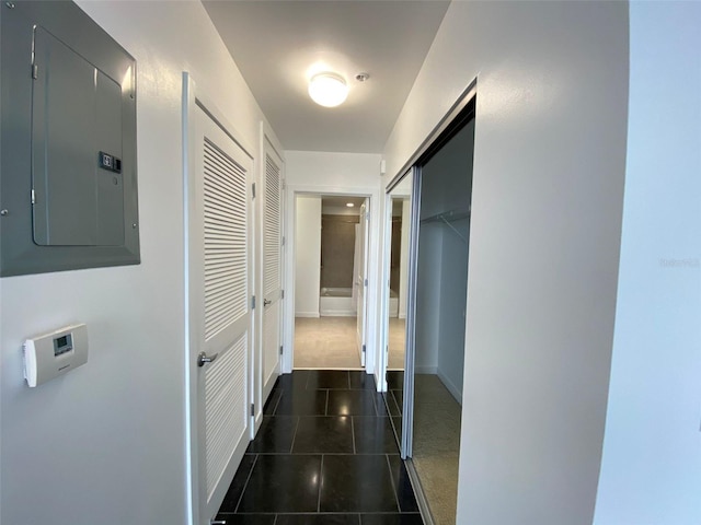 hallway featuring electric panel