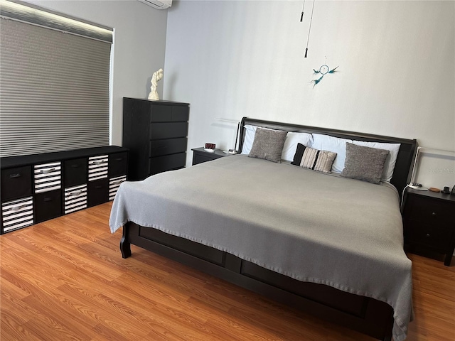 bedroom featuring hardwood / wood-style flooring