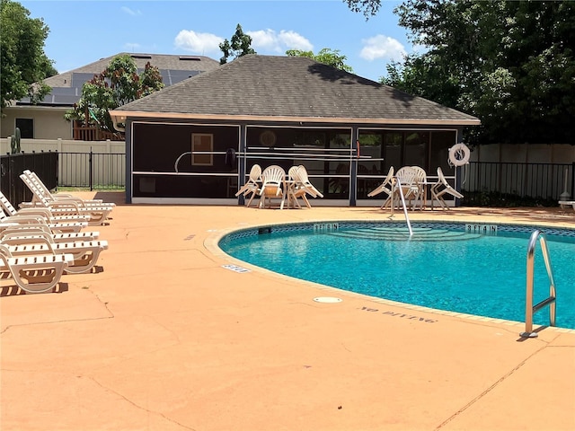 148 Joewood Trl, Davenport, FL 33837 - community pool with a patio area and a sunroom