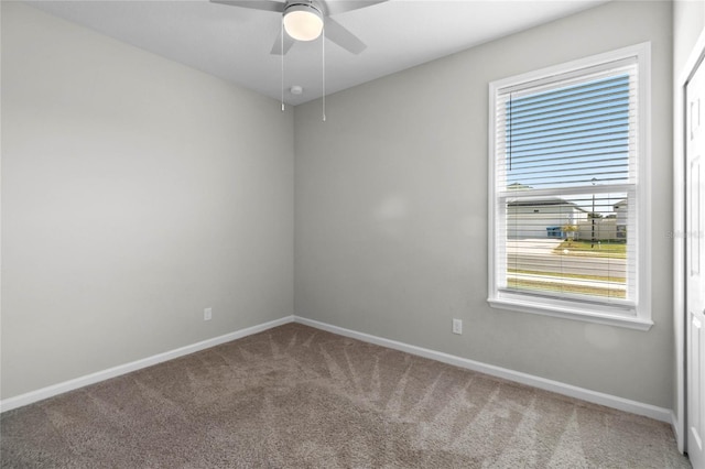 unfurnished room featuring carpet floors and ceiling fan