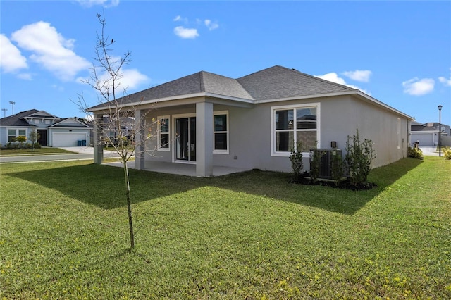 view of property exterior with a lawn, cooling unit, and a garage