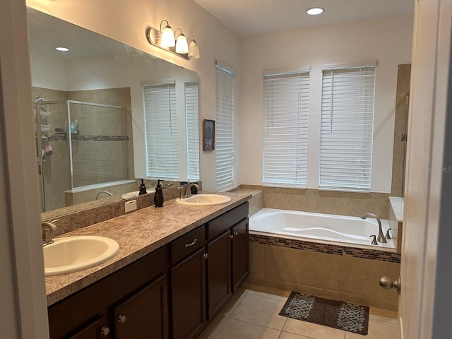 bathroom with vanity, tile patterned floors, and separate shower and tub