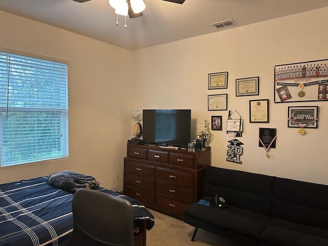 carpeted bedroom featuring ceiling fan