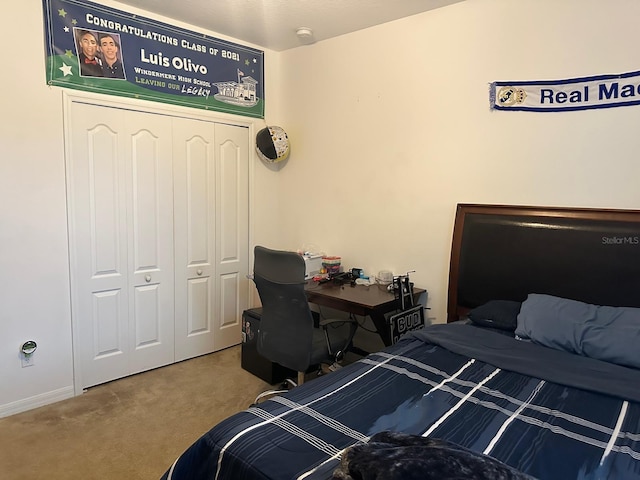 bedroom with a closet and carpet flooring