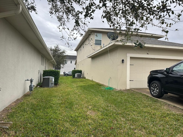 view of home's exterior with central air condition unit and a lawn