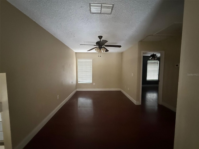 spare room featuring a textured ceiling