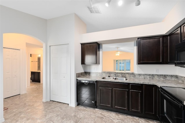 kitchen featuring ceiling fan, vaulted ceiling, black appliances, sink, and dark brown cabinets