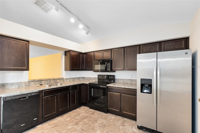 kitchen featuring black appliances, dark brown cabinets, sink, and lofted ceiling