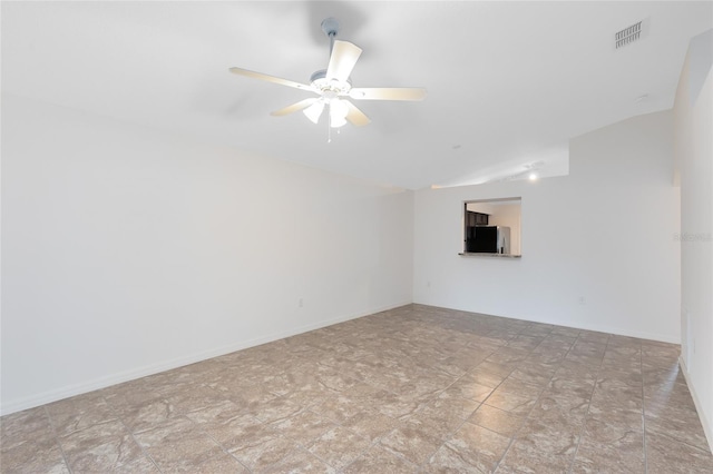 unfurnished room featuring vaulted ceiling and ceiling fan