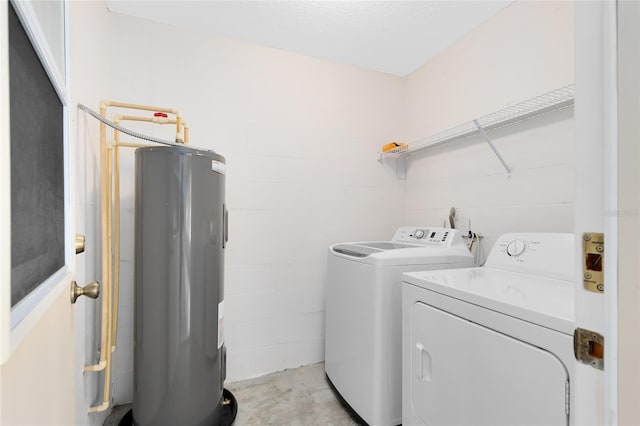 laundry room with separate washer and dryer and electric water heater