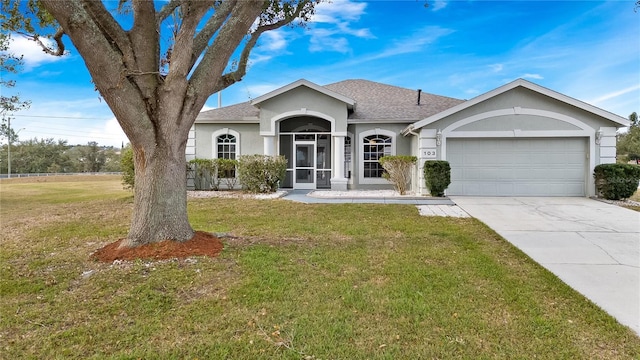 single story home with a front lawn and a garage