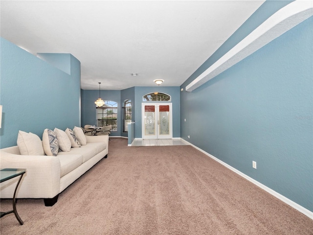 unfurnished living room featuring carpet