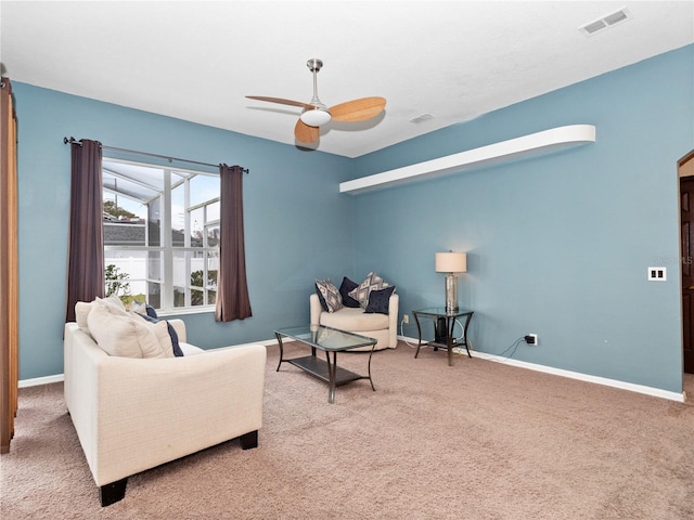 living room featuring ceiling fan and carpet flooring