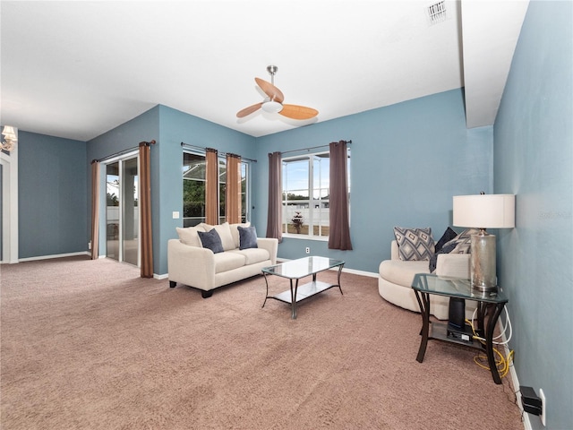 living room featuring ceiling fan and carpet flooring