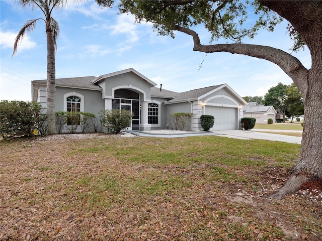 ranch-style home featuring a garage and a front lawn