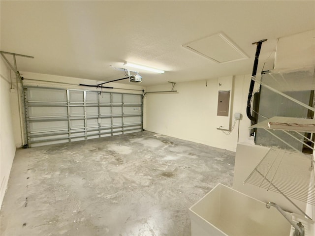 505 Pentas Ln, Haines City, FL 33844 - garage with a garage door opener, electric panel, and a sink