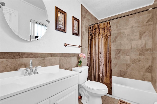 full bathroom with tile walls, vanity, shower / tub combo, toilet, and tile patterned floors